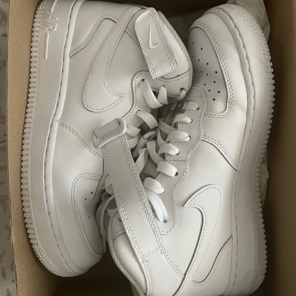 High-top Nike Air Force Ones (AF1s)